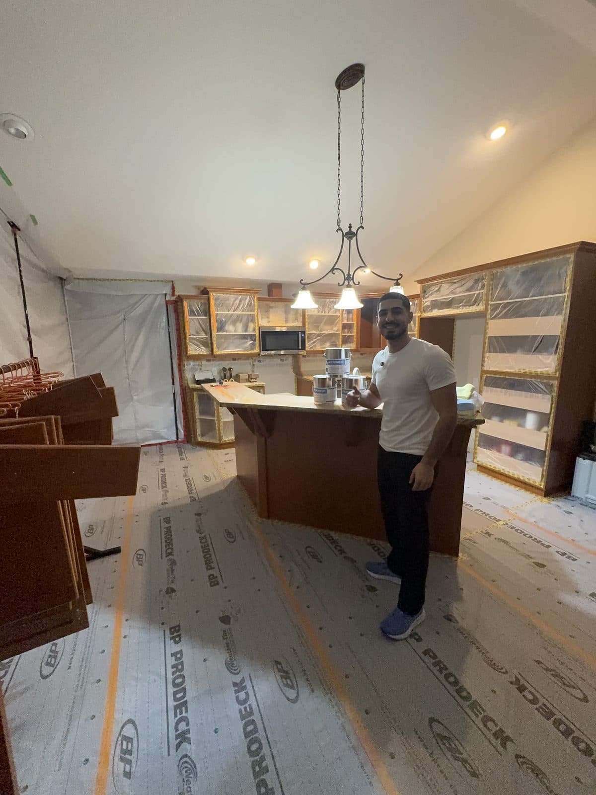 Wood cabinet refinish prep protection Wood cabinet refinishing preparation with floor protection and masking